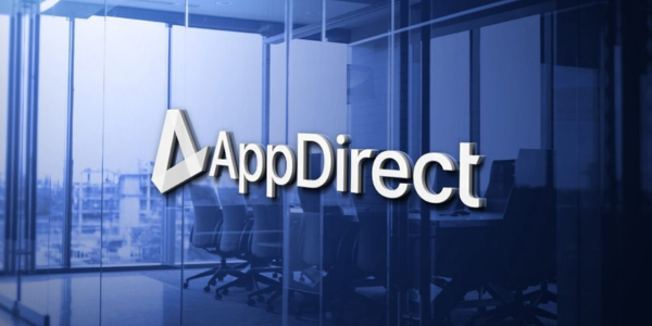 The company name, AppDirect, on a blue reflective wall, and a modern office setting in the background