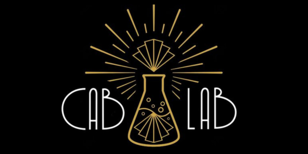 The words Cab Lab, separated by a beaker that has cabaret-style fans coming out of the top of the beaker.